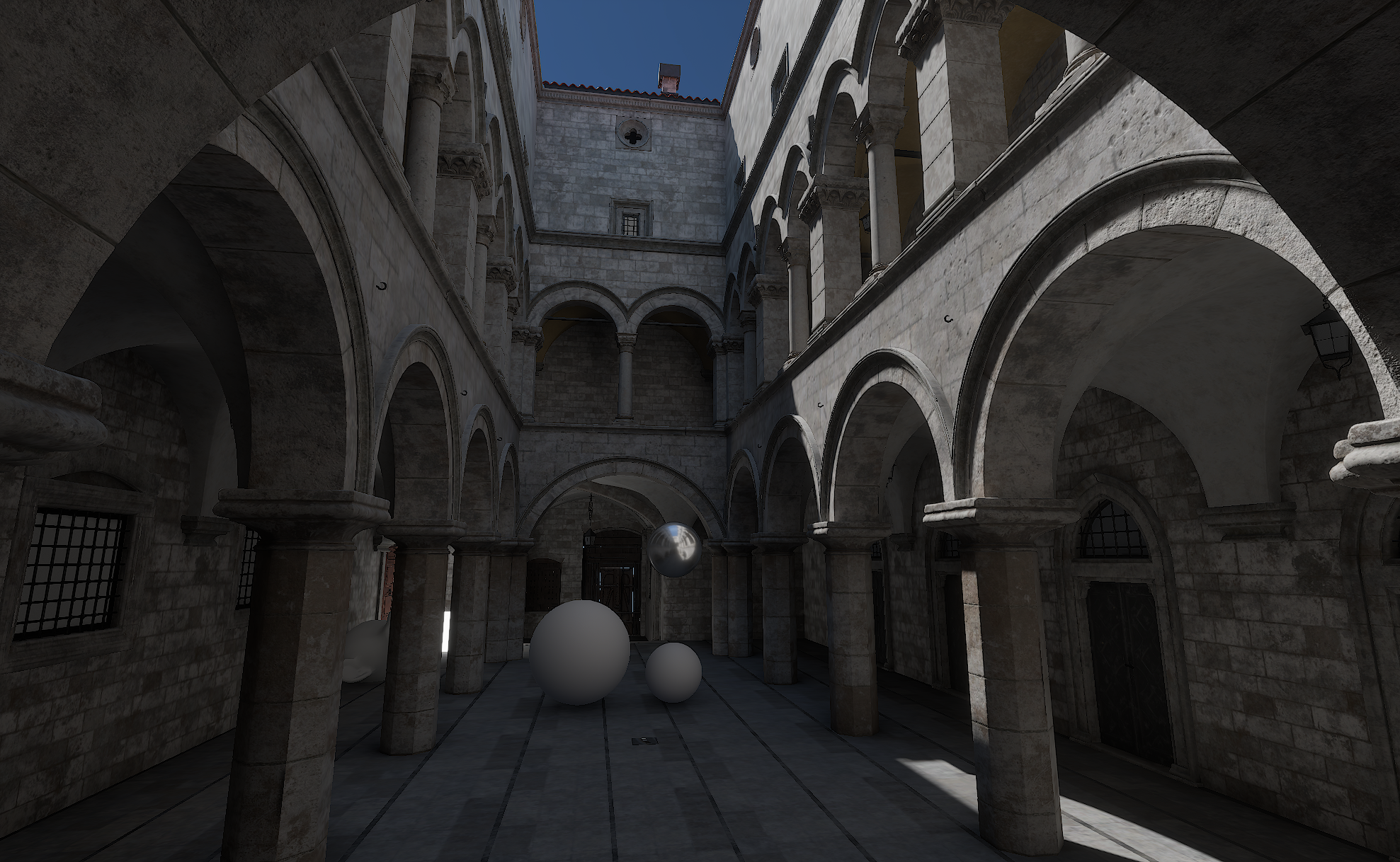 Spectral lighting across a stone courtyard with arches and reflection test spheres